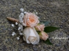 Standard ivory rose accented with peach spray roses